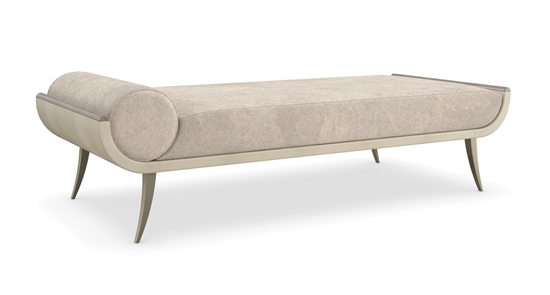 The seat and its integrated bolster pillow are meticulously tailored in a luxuriously soft velvet, providing immediate comfort and a plush look.