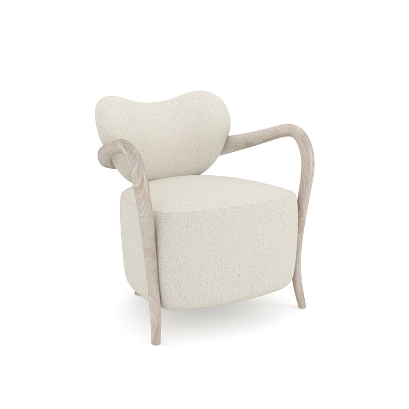 Ashanti Chair by Caracole with bold silhouette and plush upholstered seat.