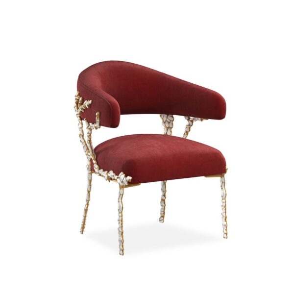 Sculptural accent chair with a custom-designed brass frame finished in Gold Brush, featuring white enamel inlay and a plush neutral seat cushion, perfect for adding luxury to modern spaces.