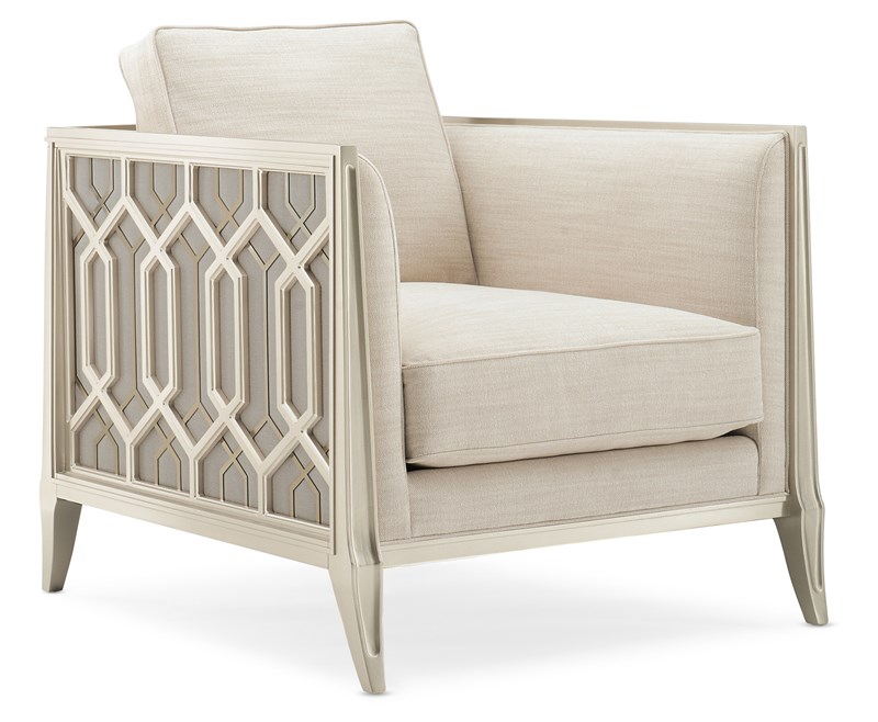 Elegant sofa featuring a carved wood frame inspired by Indian palace balcony railings, with layered metal fretwork in Soft Silver Paint and Champagne Gold finishes.
