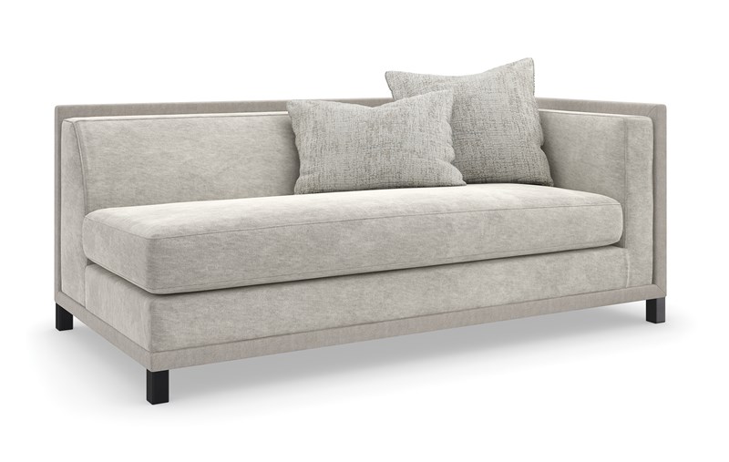 The Tuxedo RAF Sofa by Caracole (model UPH-423-RS1-A) is a sophisticated modular piece from Caracole's Upholstery collection. Designed as part of a classic shelter arm sectional, it features clean lines and crisp tailoring in a deep chocolate brown hue, inspired by modern takes on the iconic tuxedo .