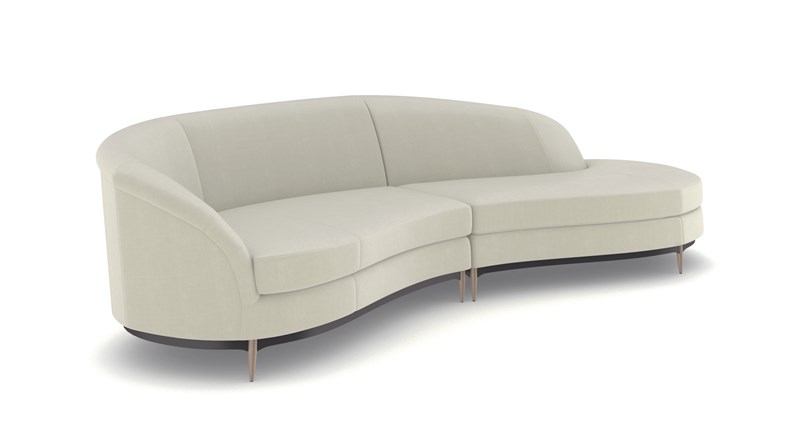Elegant sectional sofa with a soft velvet surface, curved design, and exposed wood trim in Almost Black, Threeβs Company by Caracole.