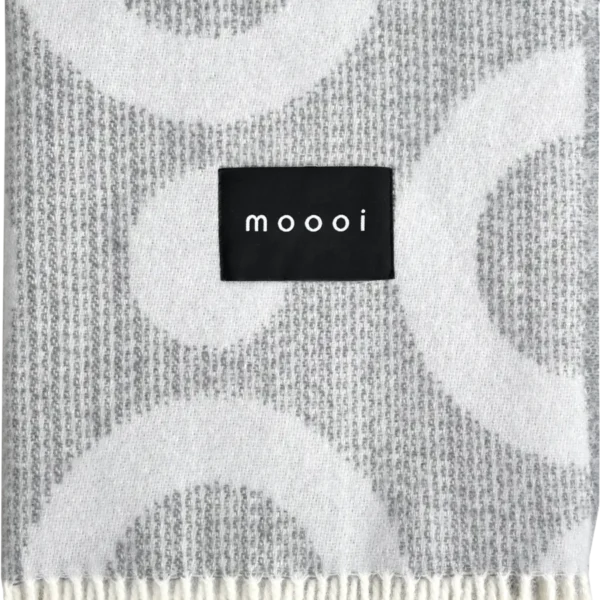 Moooi’s Blushing Sloth Blanket with charming animal artwork and vibrant colors.