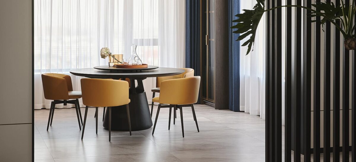 Contemporary large dining table with minimalist design and solid legs by Camerich.