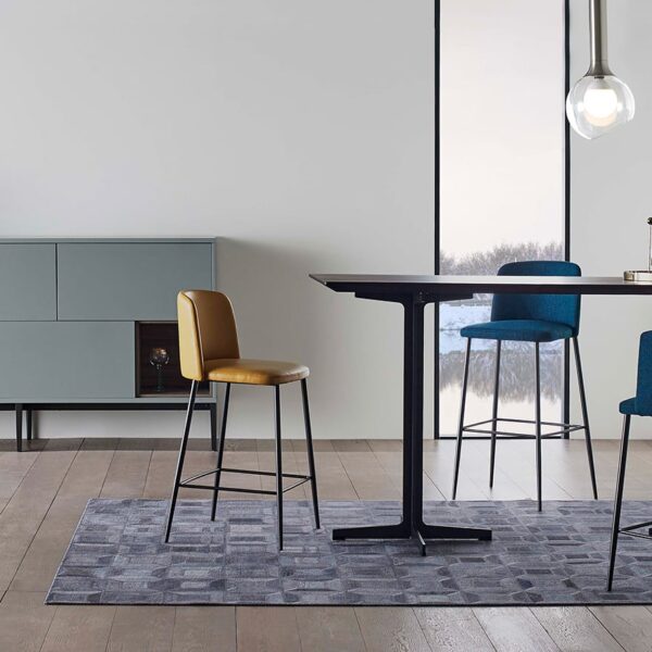 Elegant dining table with sleek wood surface and metal base by Camerich.