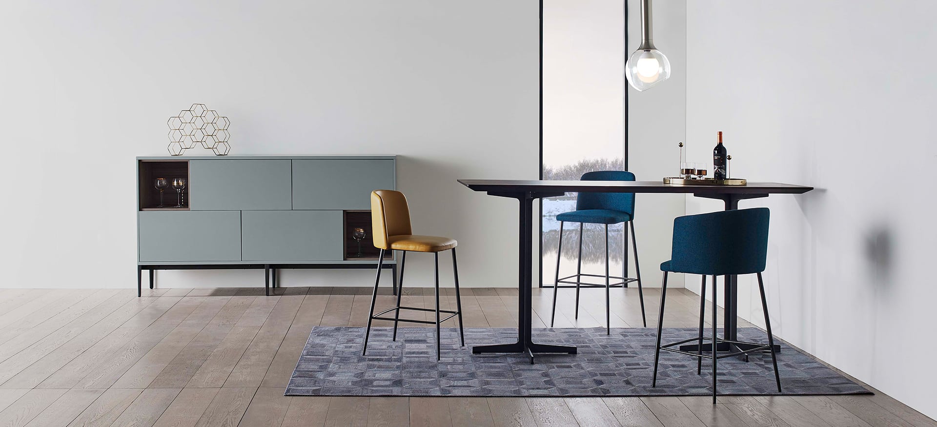 Elegant dining table with sleek wood surface and metal base by Camerich.