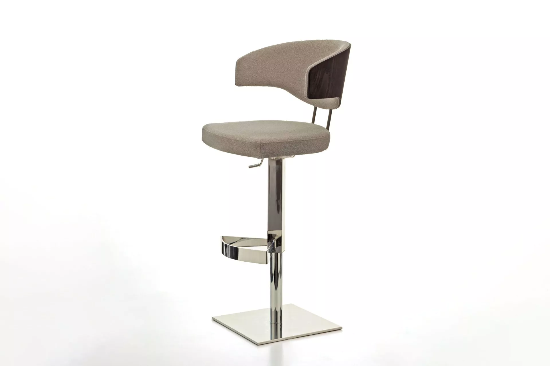 Venus W stool by Peressini in light grey quilted upholstery, round seat with mid-height backrest, on white pedestal base in a concrete-walled room.