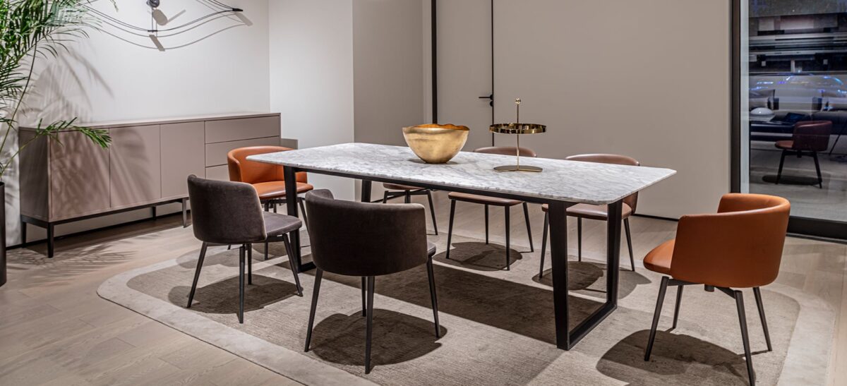The Verge Table by Camerich boasts a simple, yet sophisticated design with a high-quality wood top and modern metal legs for a contemporary look.
