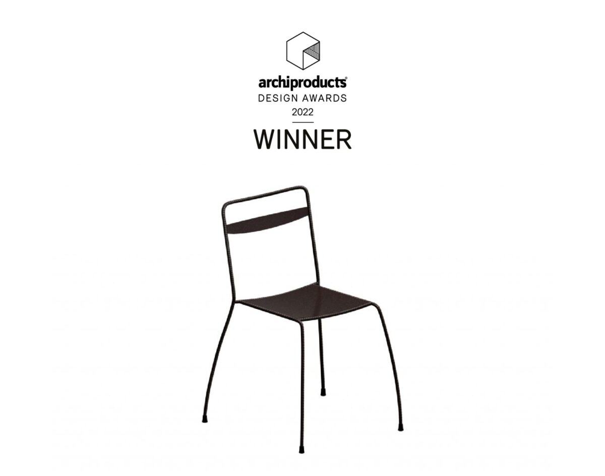 Tondella Chair in embossed white finish with minimalist tubular steel frame and horizontal backrest, placed in a contemporary indoor setting.