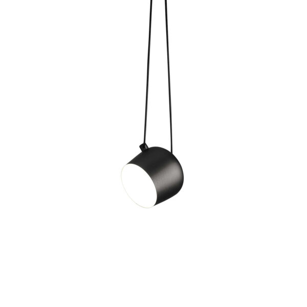 Aim by Flos, Aim pendant in matte black, its cylindrical aluminum head suspended by a long visible cable, angled to cast focused light.