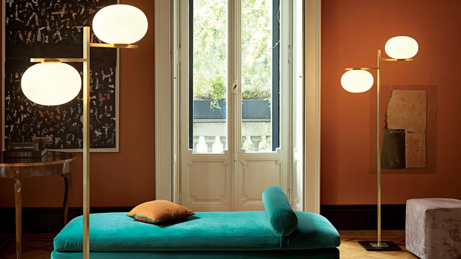 “Alba by Oluce contemporary Italian lighting – elegant curved metal arm with glowing white glass diffuser”
