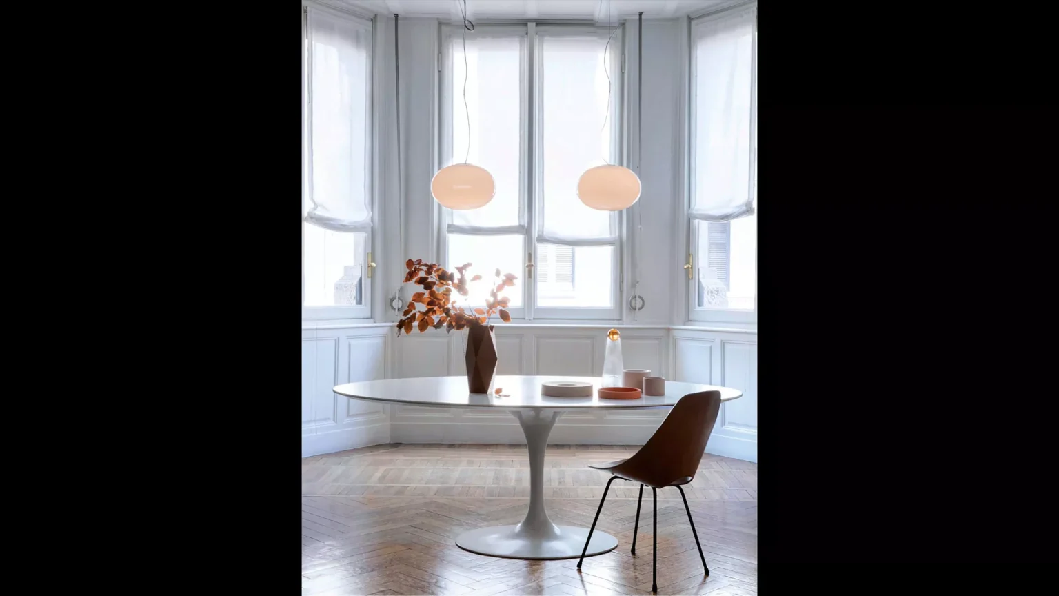 “Alba by Oluce contemporary designer lighting – elegant curved stem lamp with soft glowing glass diffuser”