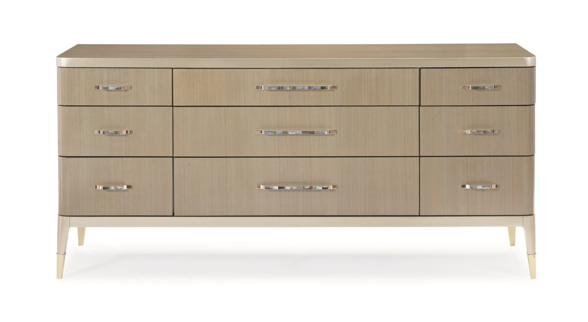 Caracole ALL DRESSED UP chest, featuring a unique cracked glass or shattered mirror effect on its door panels, contrasted with a smooth wood finish.