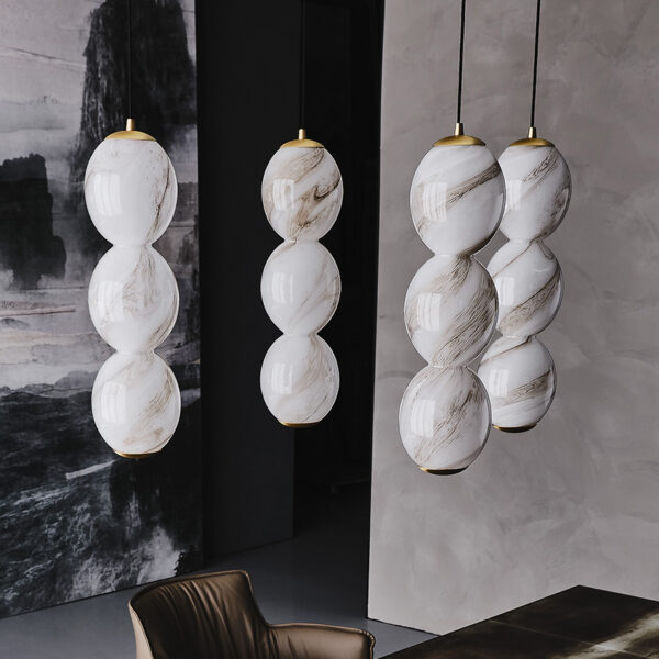 “ZANZIBALL by Cattelan Italia – modern Italian pendant lamp with spherical blown glass shade and elegant suspended design”