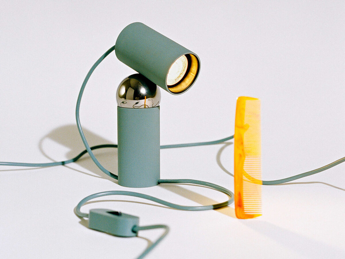 Bilboquet Table Lamp by Flos rear angle emphasizing matte polycarbonate body and steel swivel joint in a Royal Oak Michigan display