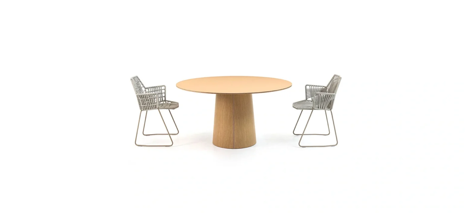 Vol Table by Moroso showcasing conical base and circular top in clay tone at the Michigan Design Center