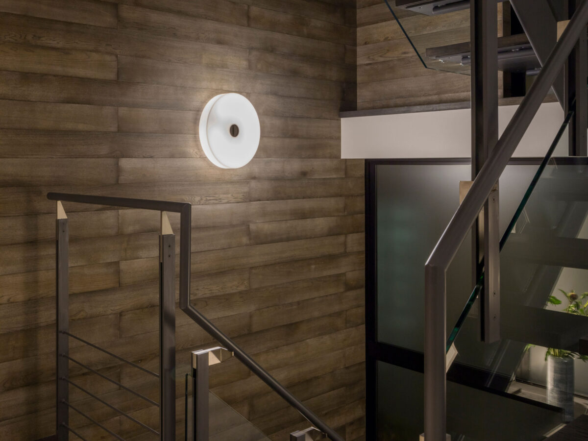 Modern and discreet, the Flos Button HL lamp, with its smooth, matte white glass surface, designed to emit a gentle, even glow when installed on a ceiling or wall.