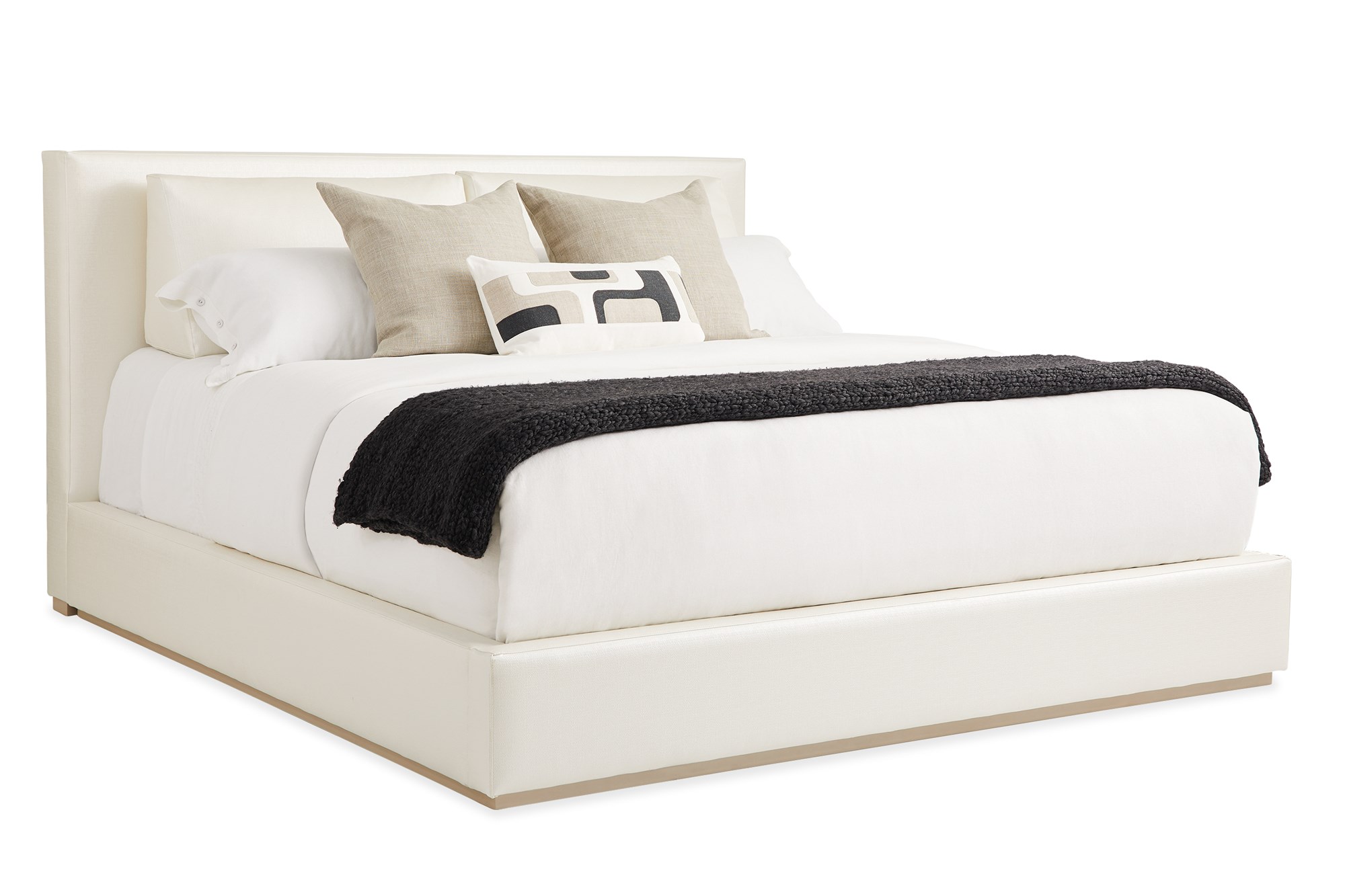 Luxurious upholstered bed with a modern, tailored headboard featuring subtle side wings, THE BOUTIQUE BED by Caracole.