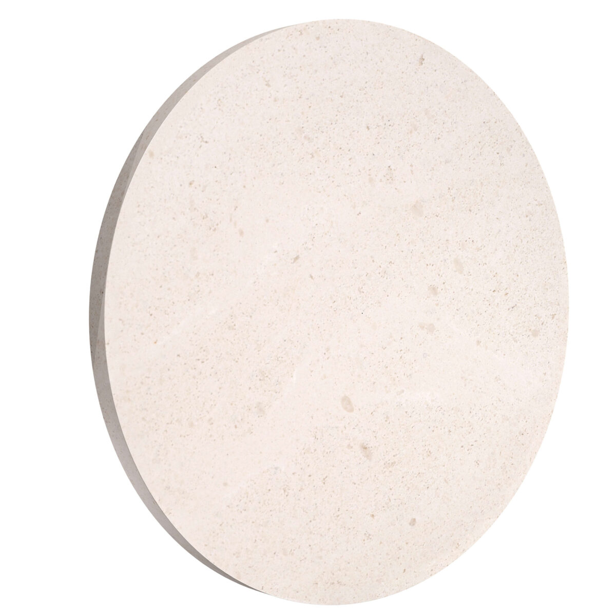 A round Flos Camouflage 240mm outdoor wall lamp made of natural Crema d'Orcia stone, subtly blending into the wall surface while emitting a soft, diffused LED light.