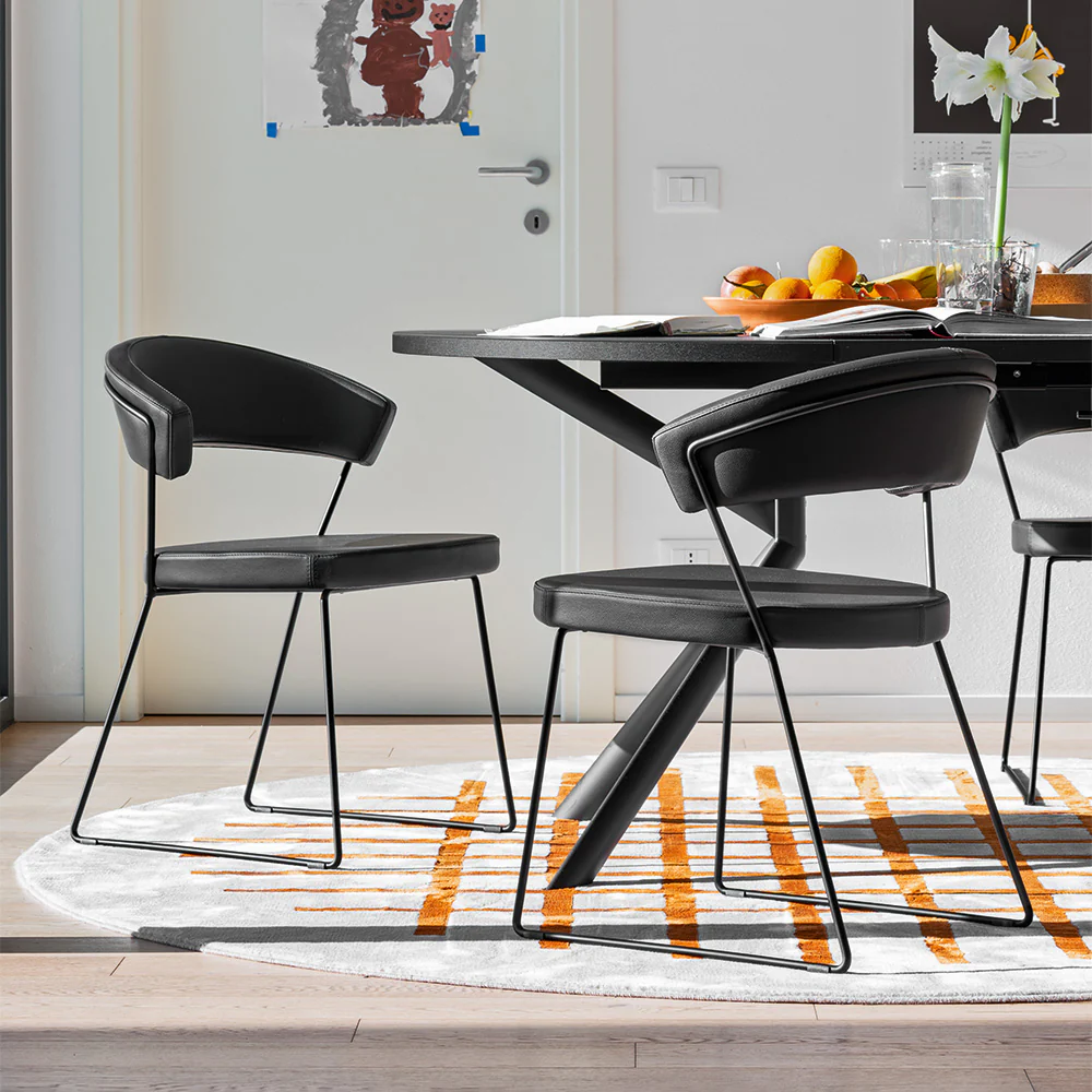 “NEW YORK by Connubia modern Italian chair – upholstered seat with wraparound backrest and sleek metal sled base”