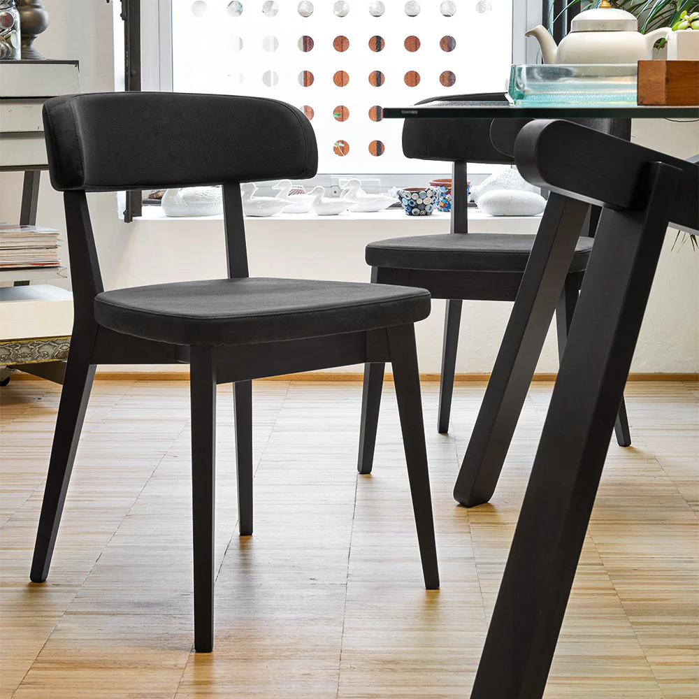 “Side view of SIREN chair by Connubia – elegant mid-century design with ergonomic shape and soft fabric”