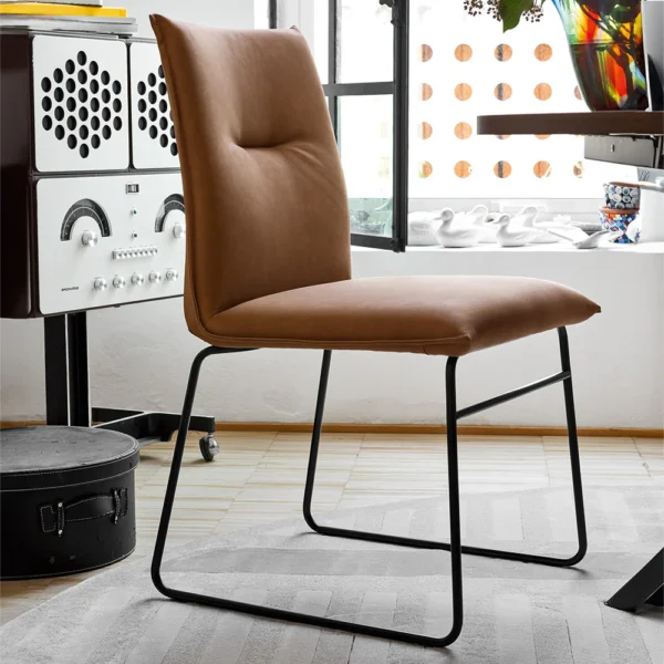 “MAYA by Connubia contemporary Italian chair – upholstered seat with gently curved backrest and metal legs”