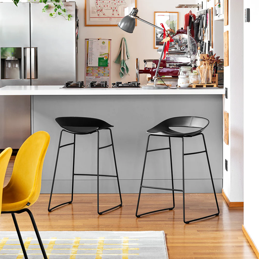 “COSMOPOLITAN by Connubia modern Italian barstool – molded polypropylene seat with slim metal legs and integrated footrest”
