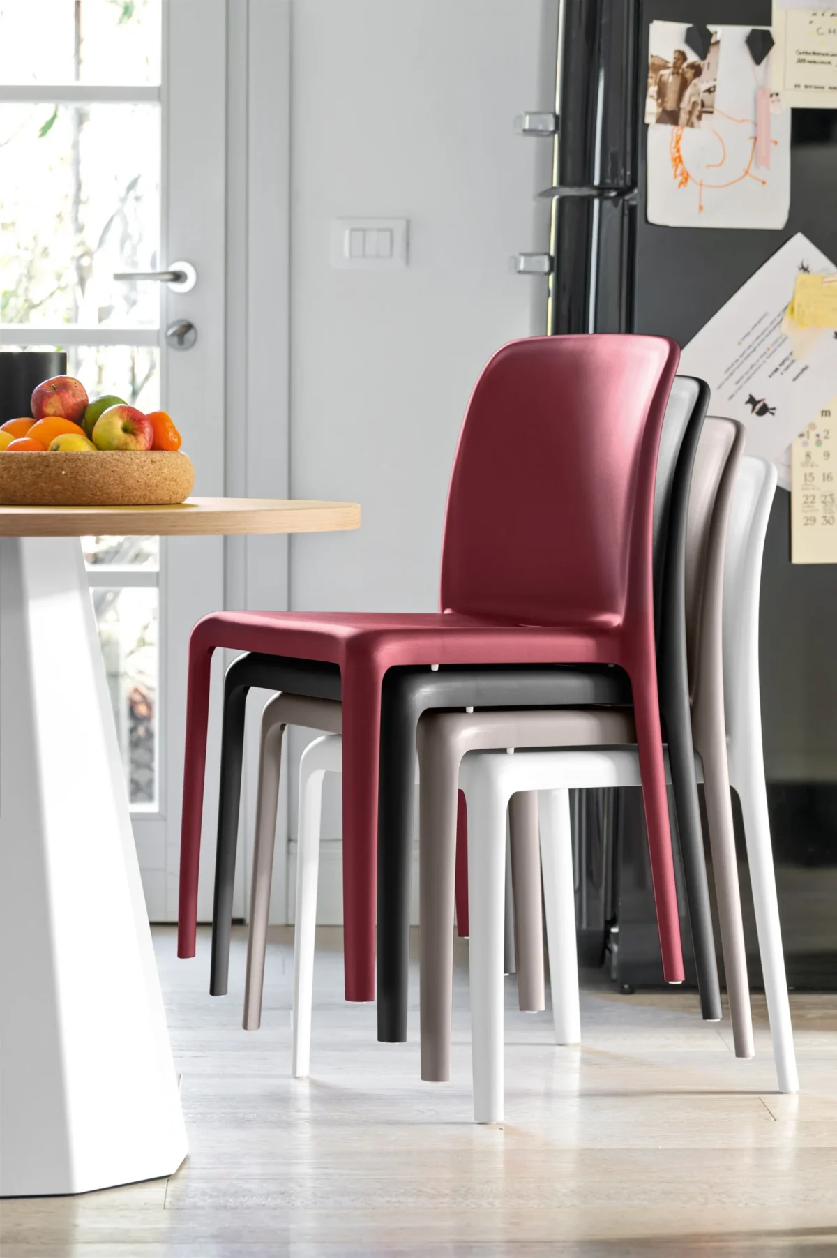 “Side view of BAYO chair by Connubia – lightweight contemporary design ideal for indoor and outdoor seating”
