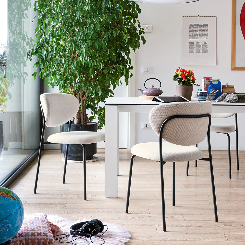 “DORIA by Connubia contemporary upholstered chair – sleek Italian design with curved backrest and soft padded seat”