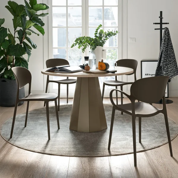 “DIX by Connubia in a modern interior – elegant round table with ceramic or wood finish and central pedestal support”