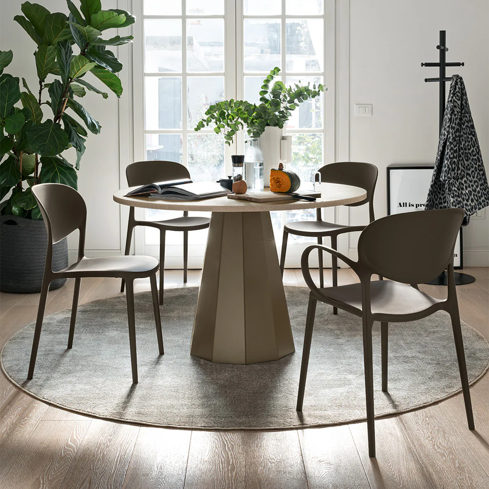 “DIX by Connubia in a modern interior – elegant round table with ceramic or wood finish and central pedestal support”