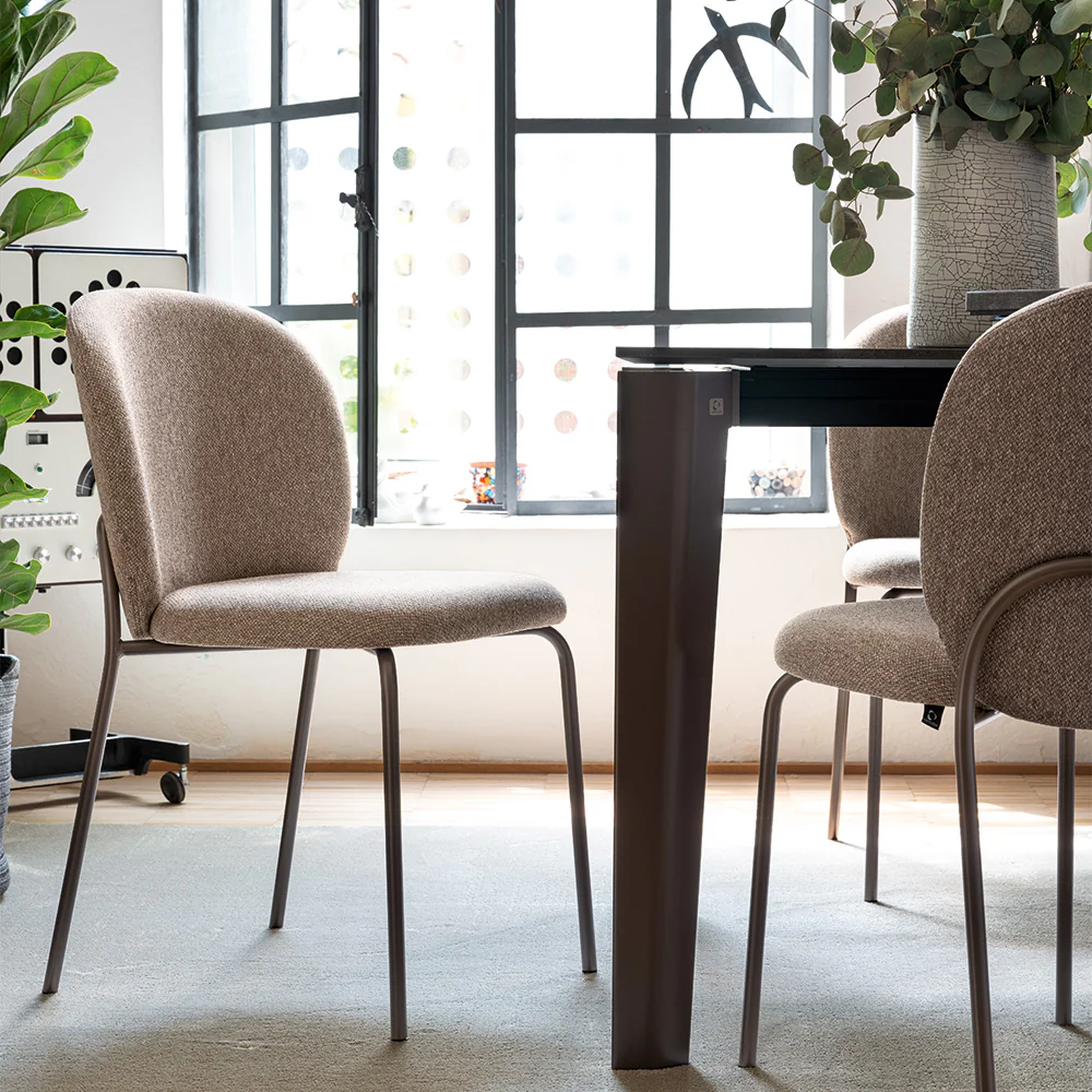 “Side view of COZY MID by Connubia – sleek contemporary dining chair in neutral fabric”