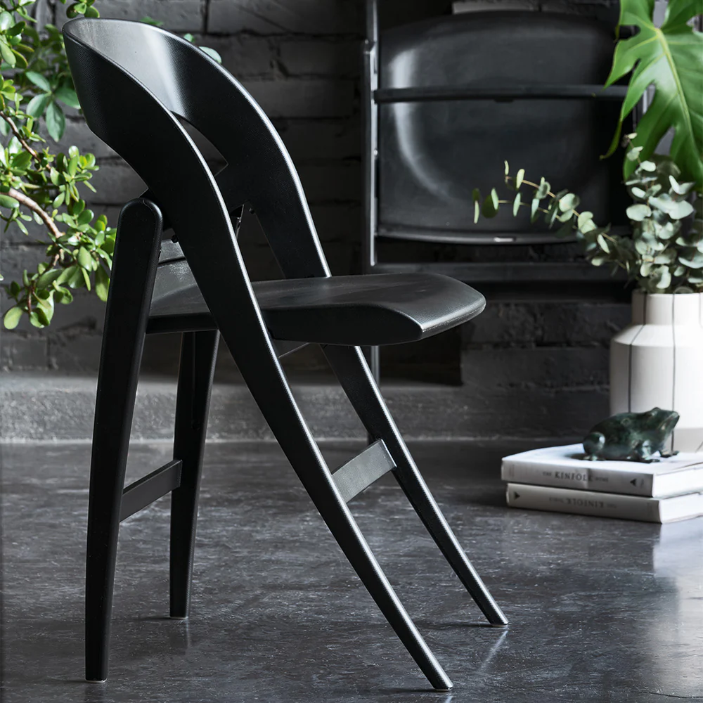 “Top view of CLIKCLAK by Connubia – contemporary table with lift-up surface for smart storage”