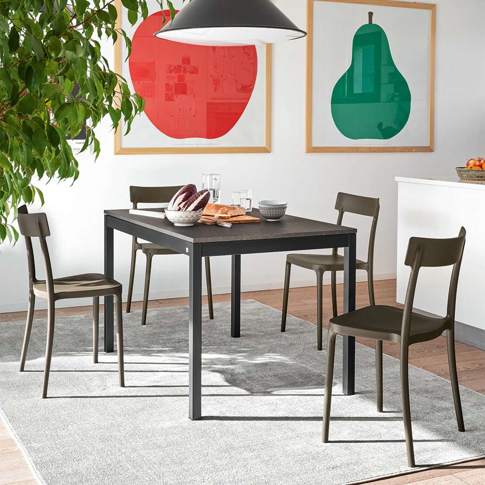 “Side angle of ABBY chair by Connubia – minimalist Italian design blending comfort and style”