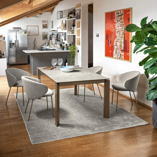 “VULLY by Connubia modern upholstered chair – Italian-crafted design with plush seat, curved backrest, and sleek metal legs”