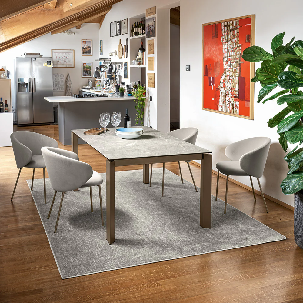 “VULLY by Connubia modern upholstered chair – Italian-crafted design with plush seat, curved backrest, and sleek metal legs”