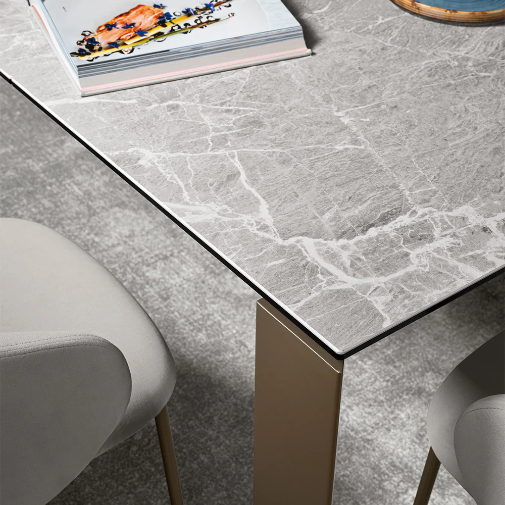 “Side view of GATE table by Connubia – contemporary table with extendable surface and angular leg structure”