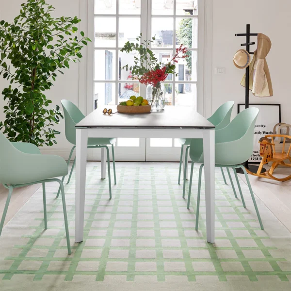 “Side view of PENTAGON FAST table by Connubia – unique geometric shape with clean lines and metal base”