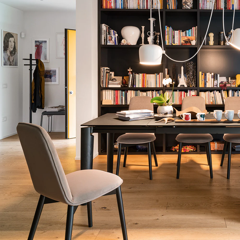 “Close-up of RILEY chair by Connubia – soft padded seat and sleek silhouette for modern interiors”