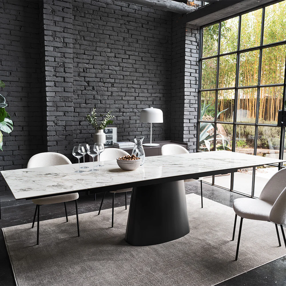 “ELLISSE dining table by Connubia in modern interior – minimalist oval design with durable top and artistic base”