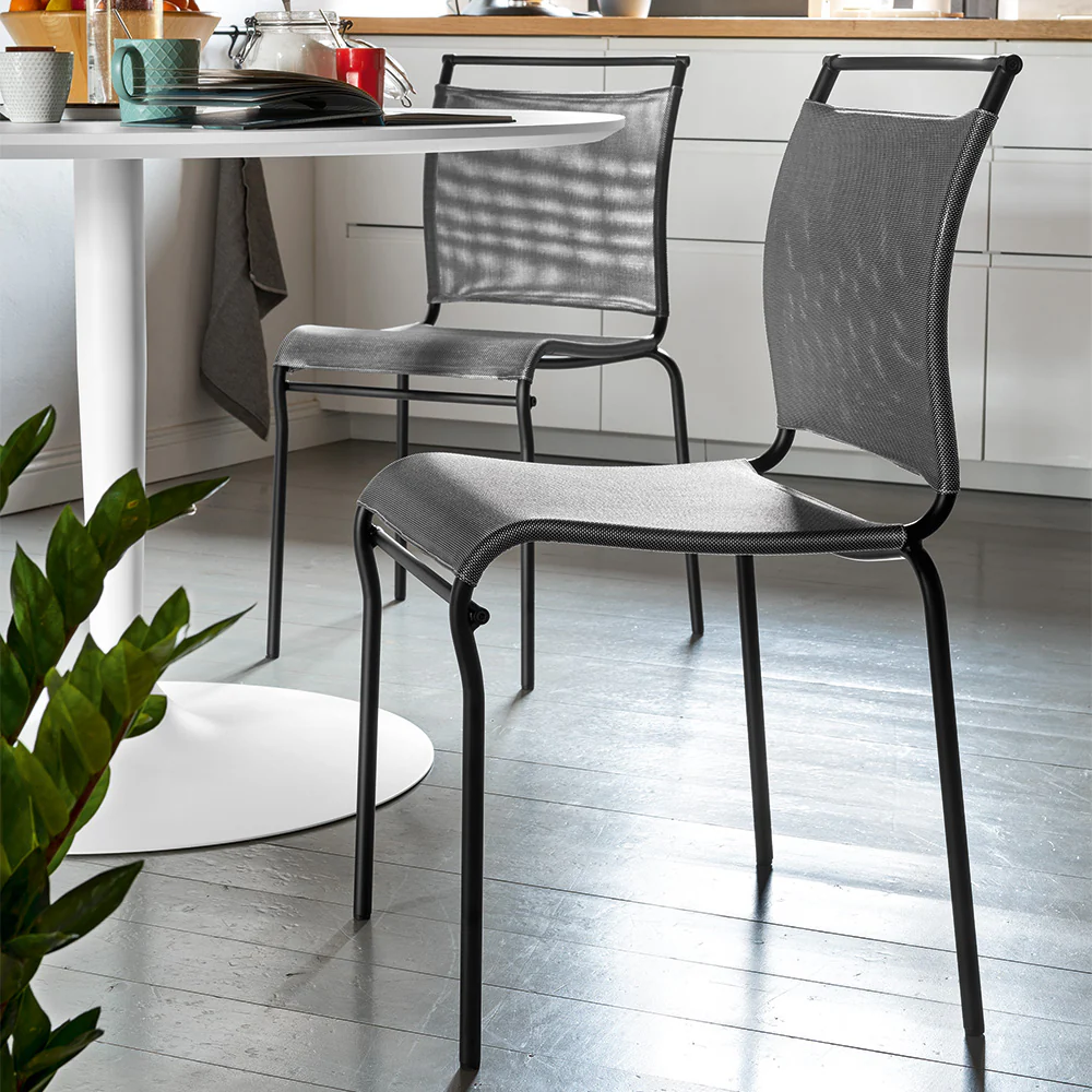 “Side view of AIR chair by Connubia – lightweight design with minimalist lines and ergonomic support”