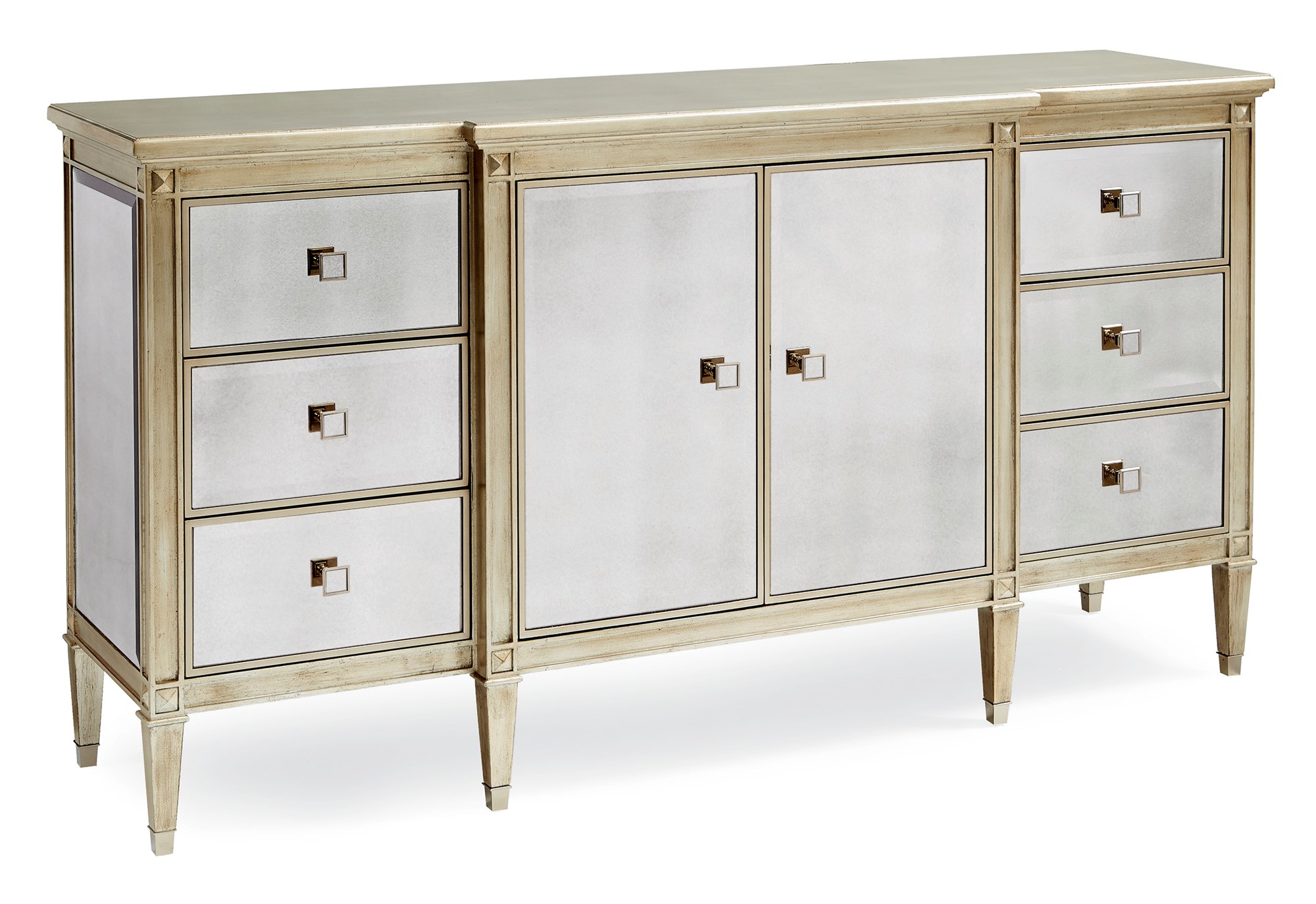 La‑Dee‑Dah Dresser by Caracole — a 74″‑wide carved dresser with six soft‑close side drawers and two mirrored center doors, finished in Auric silver leaf with beveled antique-mirror fronts, square tapered carved feet with metal ferrules, and a gold-painted interior featuring a tray drawer and shelf.