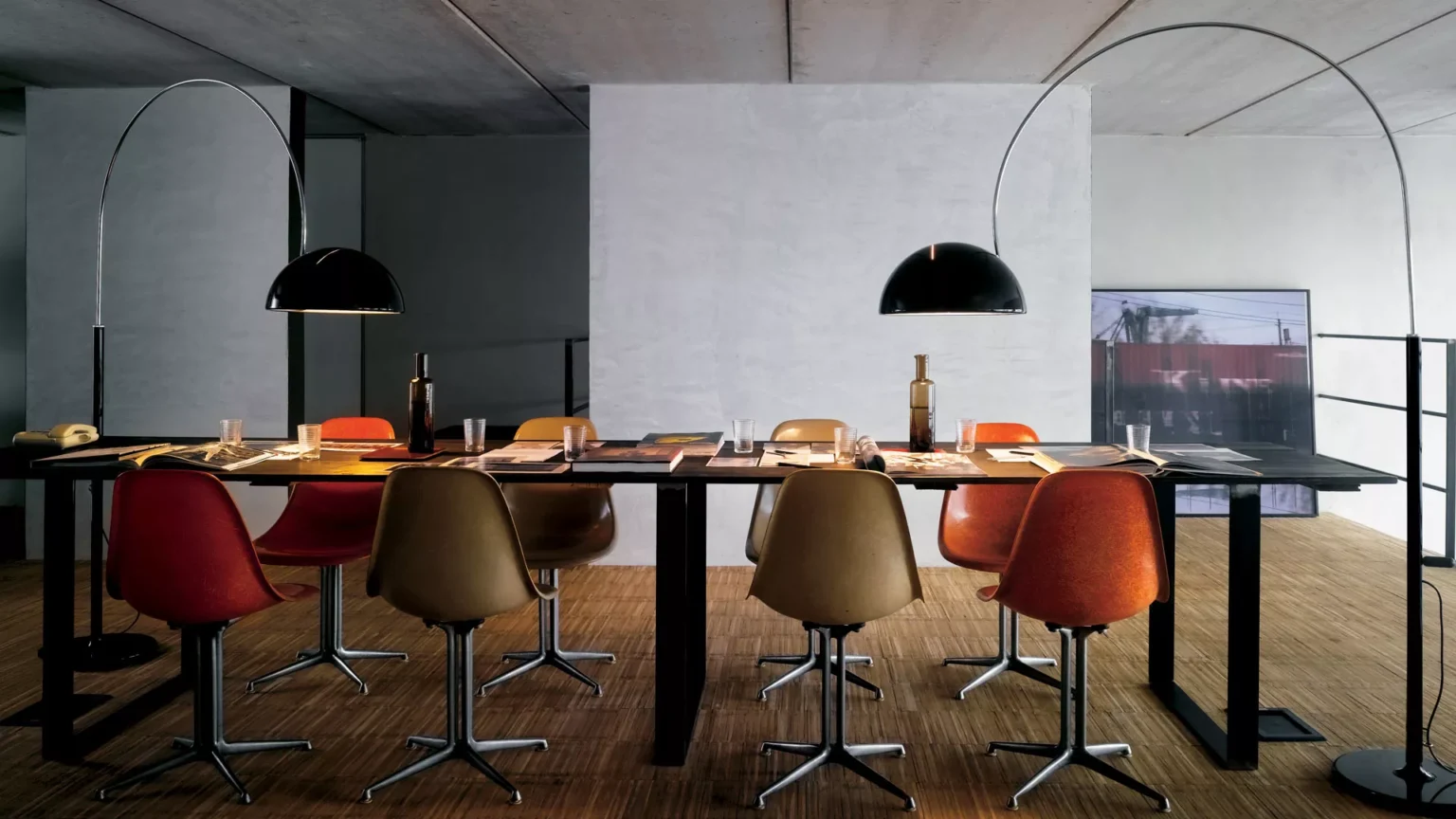 “Coupé by Oluce contemporary designer lighting – minimalist Italian lamp featuring smooth curves and polished finish”