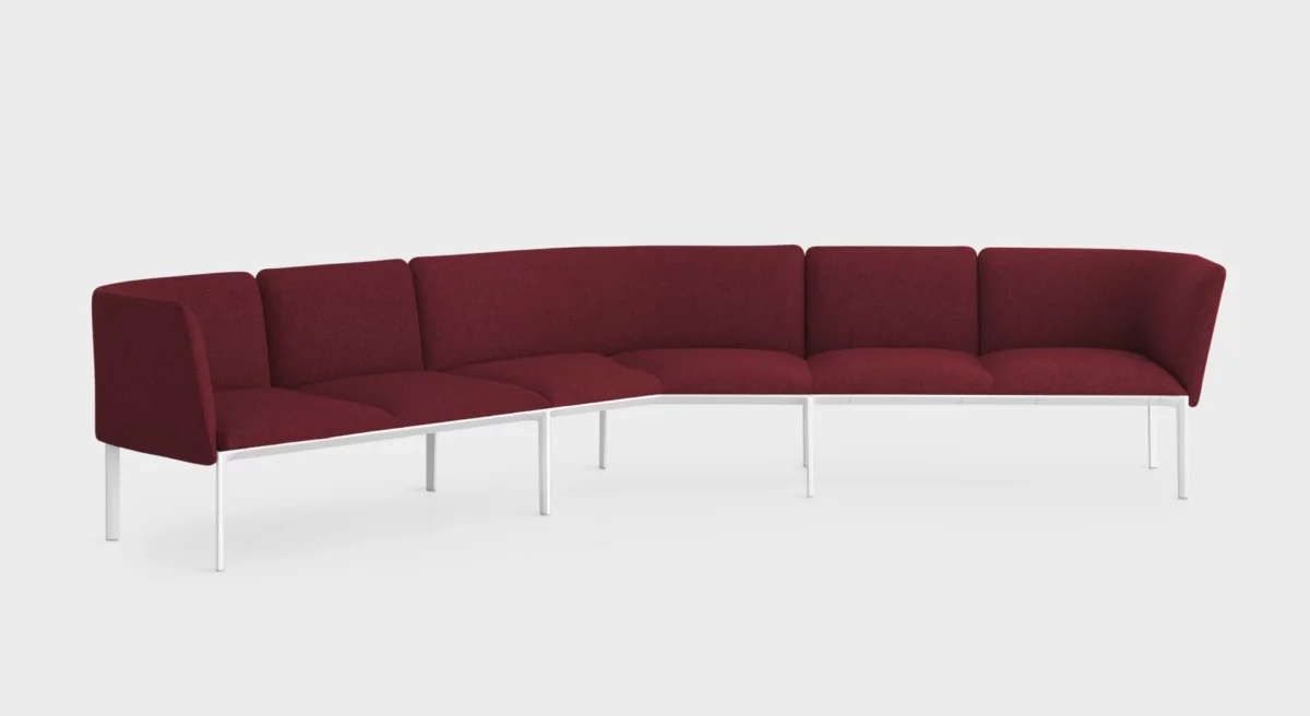 Lapalma PLUS V-Shape modular seating with curved elements and removable fabric covers, designed for flexible configurations in modern interiors.