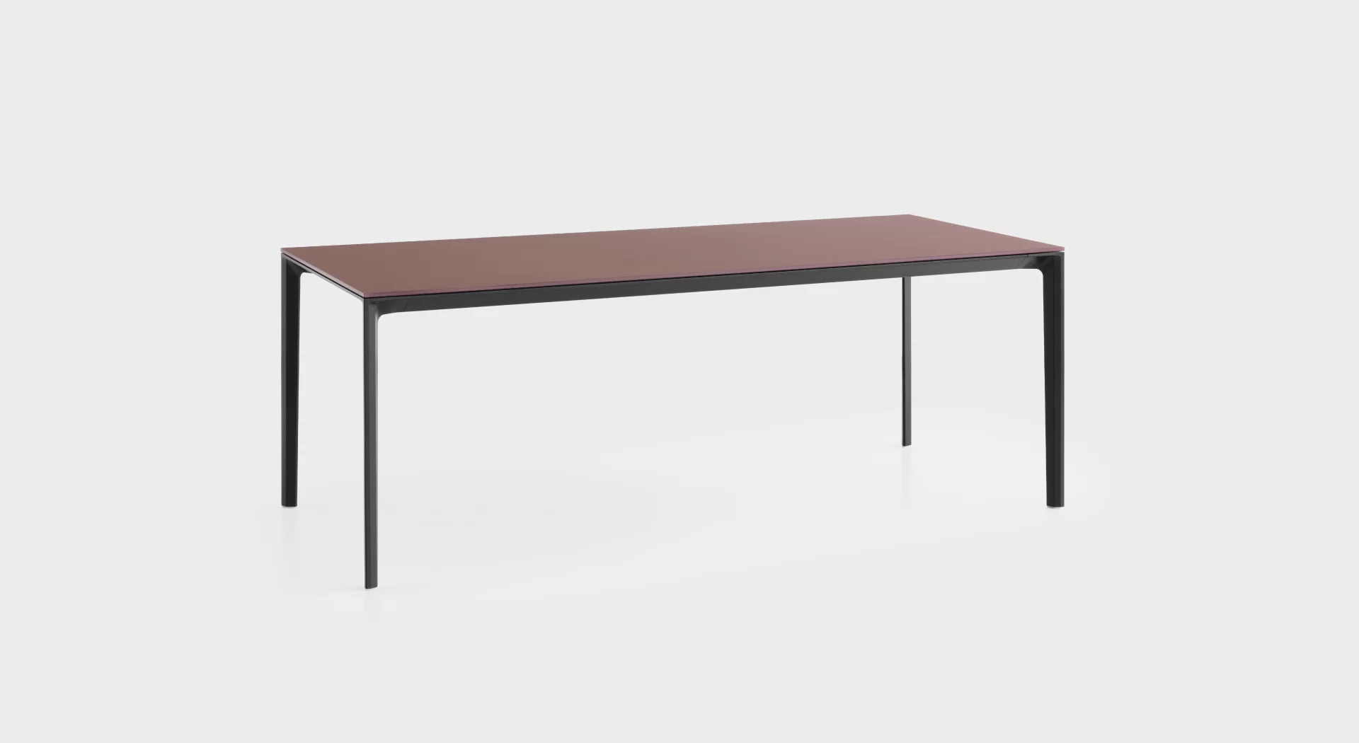 Modular system of tables with frame in aluminium extrusion and die-cast aluminium corner and linking legs, all powder coated, which allows several configurations. Tops available in HPL Fenix® 10 mm or veneered in wood in several finishes.