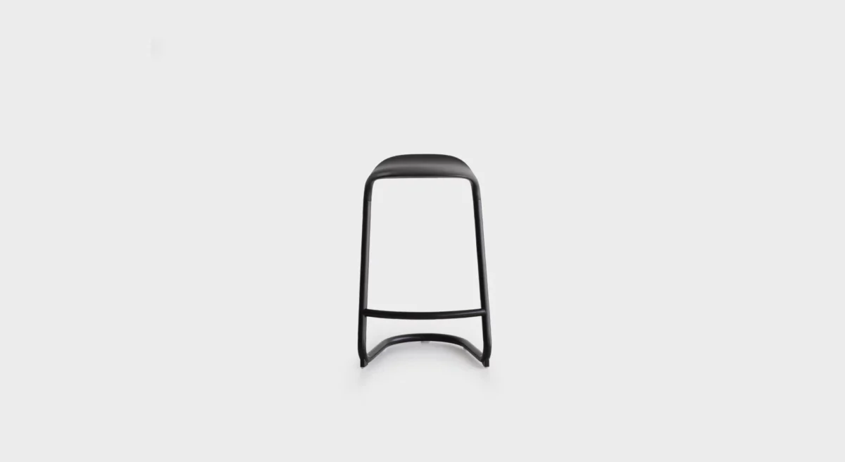 “Lapalma S451 chair in matte black finish with light upholstery, positioned around a wood dining table in a contemporary home.”