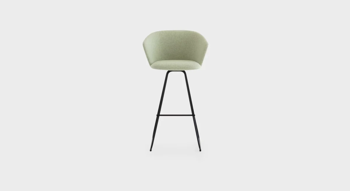 “Lapalma Glove S473 stool in navy blue upholstery with black powder-coated sled base, positioned at a high-top table in a stylish lounge.”
