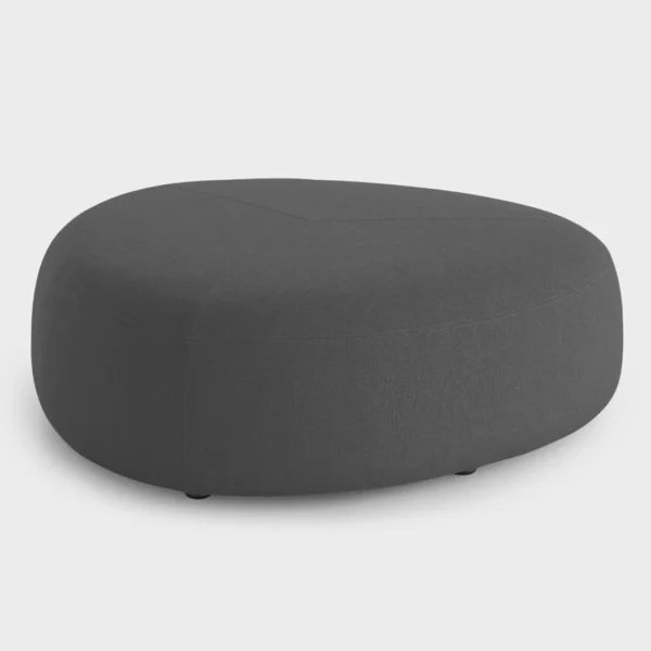 “Lapalma Kipu D05 pouf with rounded triangular shape, upholstered in soft grey fabric, positioned in a modern lounge area.”