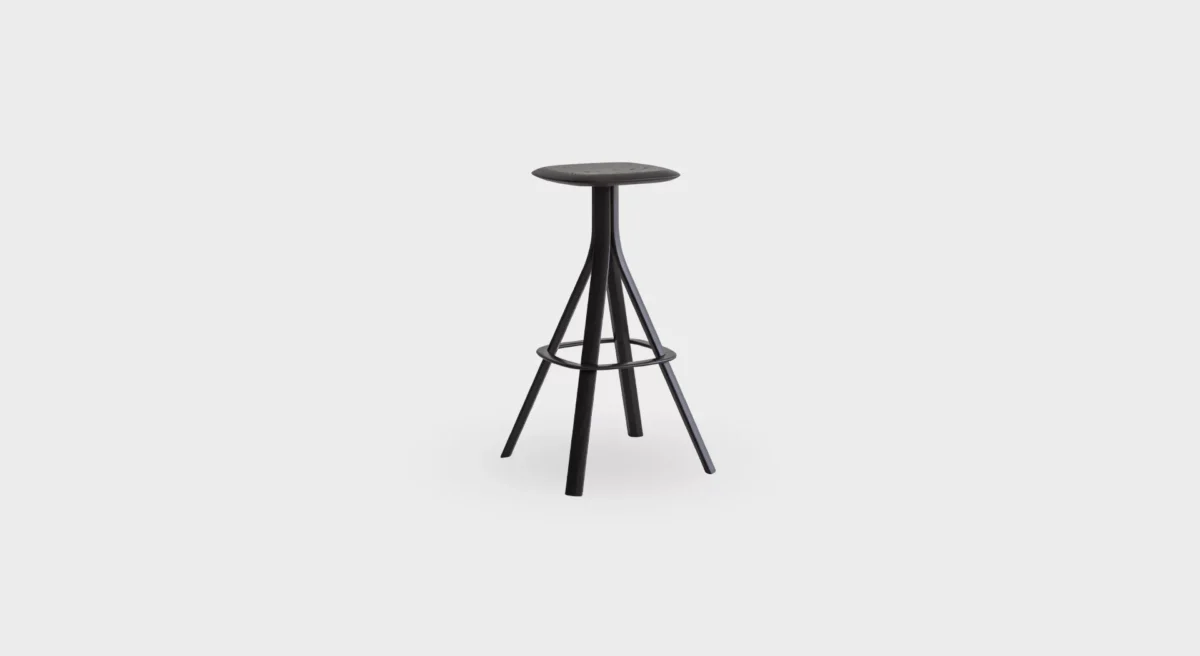Lusto S461 four-legged stool by Lapalma, designed by Karri Monni, featuring a solid ash wood frame in natural or black finish, powder-coated steel footrest, and a painted or fully upholstered seat in fabric, leather, or eco-leather.