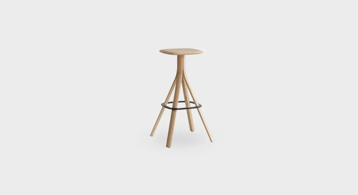 Lusto S461 four-legged stool by Lapalma, designed by Karri Monni, featuring a solid ash wood frame in natural or black finish, powder-coated steel footrest, and a painted or fully upholstered seat in fabric, leather, or eco-leather.